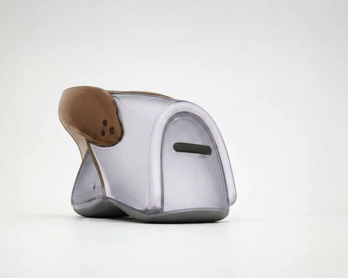 Low-angle view of the grey cicada chair at 315°, resonator slot at child eye level.